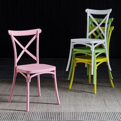 comprar Eventos de bodas en hoteles PP sillas de comedor de plástico rosa apilables personalizadas X espalda cruz Fabricación en línea
